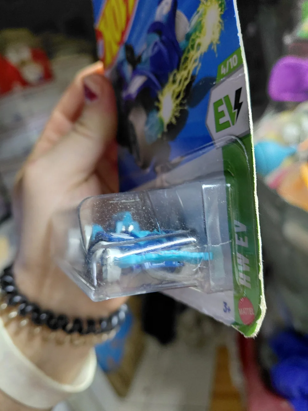 the Hot Wheels Wattzup electric concept car in blue from the HW EV series (4/10,